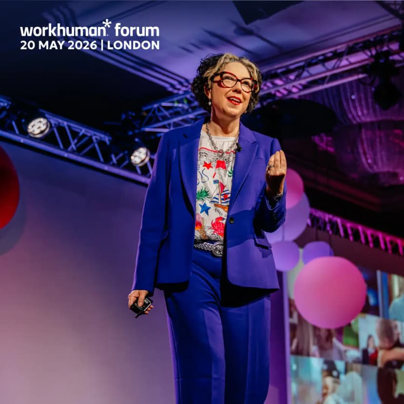 A speaker in a bright blue suit stands on stage, delivering a presentation at the Workhuman Forum in London. She is animatedly gesturing with one hand while holding a microphone in the other, engaging with the audience. Behind her, colorful balloons and visuals can be seen on the screen. The event is dated 20 May 2026, as indicated by the text overlay.